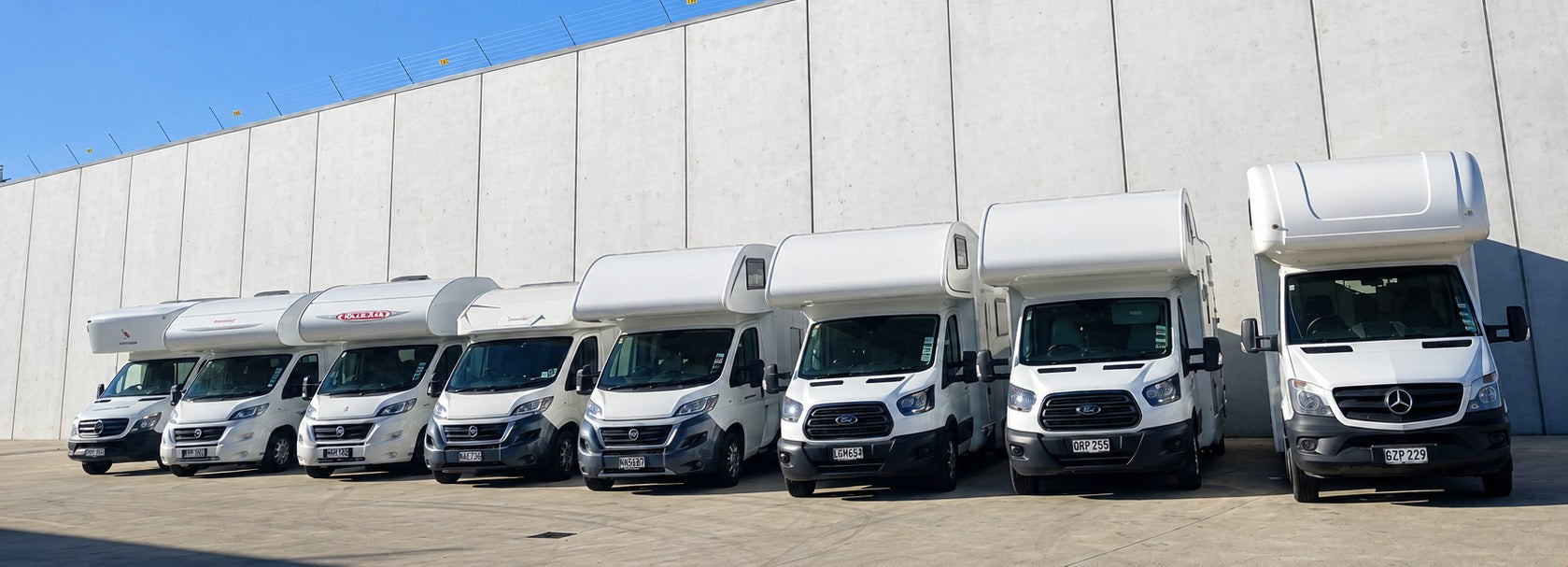Row of motorhomes in the secure RV Masters yard, Hamilton